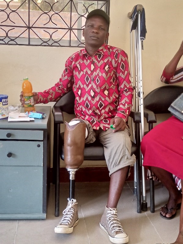 Man with transtibial prosthesis working